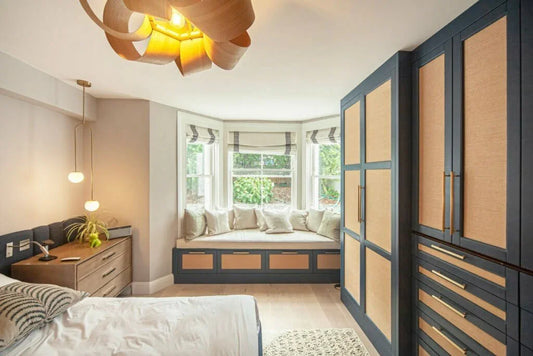 Wardrobe detail – shaker cabinetry inset with woven hemp panels for an unexpected, design‑forward application